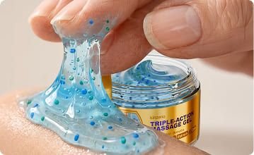 Hand applying Kinzeno gel to skin, with the open jar visible in the background